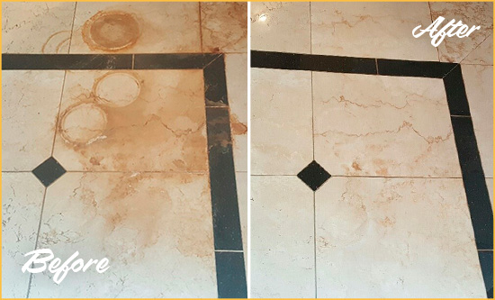 Before and After Picture of a Boyds Hard Surface Restoration Service on a Marble Floor to Eliminate Rust Stains